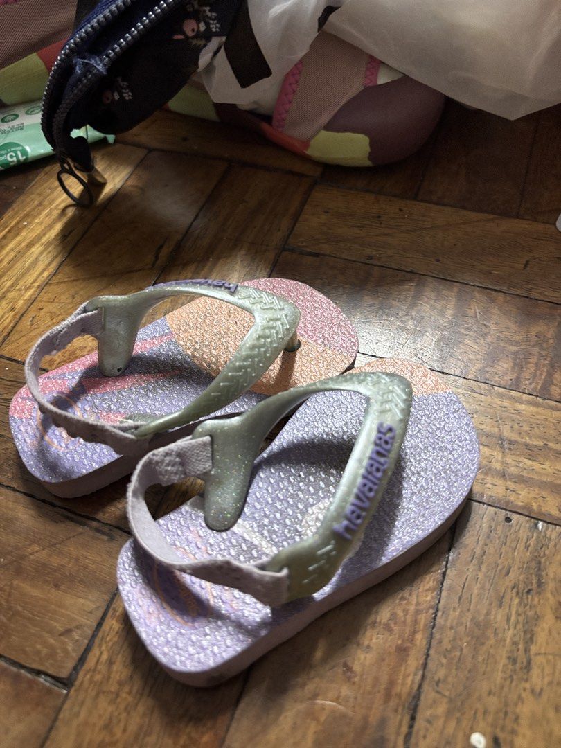 Havaianas Baby Flip Flops with Strap (Category: Babies & Kids Fashion) located in Manila. Submitted by ruthy1513 (Listing ID 1442861879, Image 2). Description: - Adorable Havaianas flip flops for kids - Features a sparkly glitter strap - Includes a secure back strap for a snug fit - Fun and colorful pattern on the soles - Easy to slip on and off - Ideal for beach days or everyday adventures.