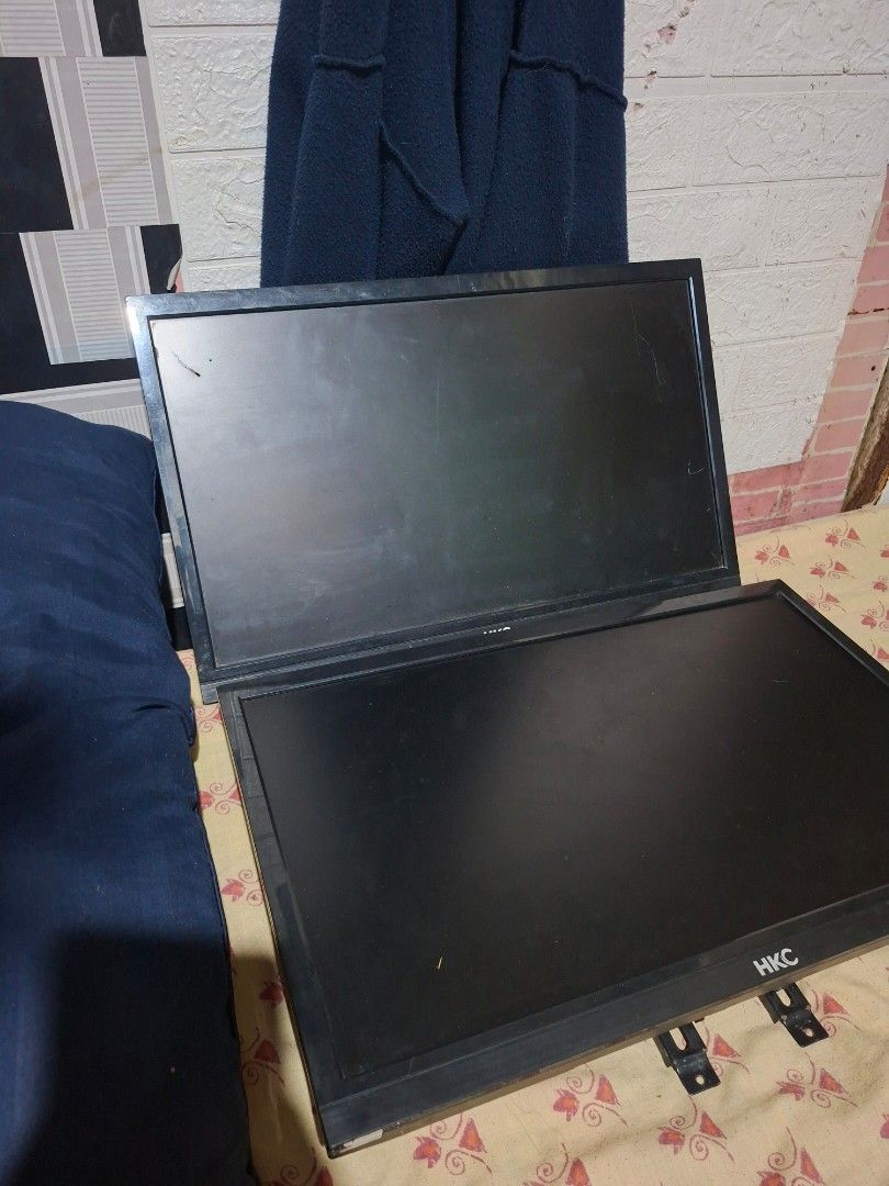 HKC Computer Monitors (2x) RUSH FOR SALE (Category: Desktops) located in Taguig. Submitted by jesicutie (Listing ID 1442792973, Image 1). Description: - Two HKC computer monitors - Color: Black - One monitor has a minor scratch on the screen - Mounts are already attached for easy setup - Ideal for a dual-screen workstation.