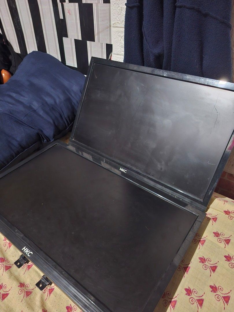 HKC Computer Monitors (2x) RUSH FOR SALE (Category: Desktops) located in Taguig. Submitted by jesicutie (Listing ID 1442792973, Image 2). Description: - Two HKC computer monitors - Color: Black - One monitor has a minor scratch on the screen - Mounts are already attached for easy setup - Ideal for a dual-screen workstation.