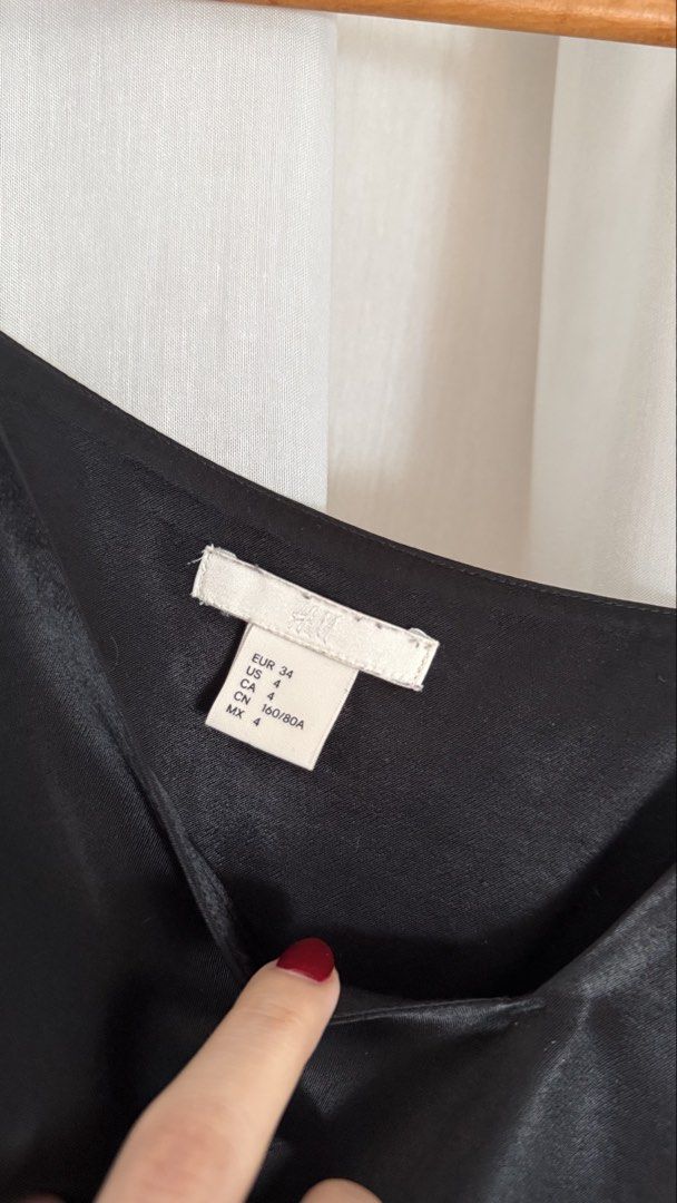 H&M Black Silk Camisole Top (Category: Sleeveless) located in Makati City. Submitted by victoriatrishaa (Listing ID 1442792073, Image 3). Description: Black silk camisole from H&M. Adjustable spaghetti straps. L: 24.5 W: 14”.