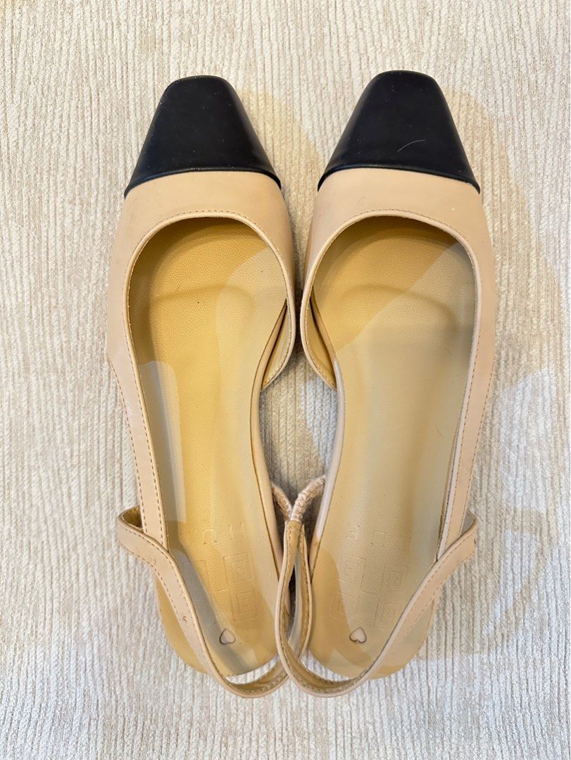 Hue Beige Slingback Flats with Black Cap Toe (US 9) (Category: Flats & Sandals) located in Paranaque City. Submitted by seriousshopper678 (Listing ID 1442810980, Image 1). Description: - Cute beige slingback flats - Black cap toe detail - Elasticated straps for a comfortable fit - Minor signs of wear on insoles and heel edges -small cracks on strap & light peeling in inner shoes - Ideal for everyday wear Shipping c/o buyer through Lalamove or gra