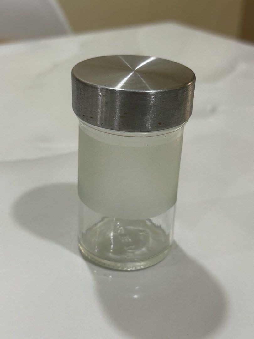 IKEA Glass Jar with Metal Lid (Category: Food Organization & Storage) located in Manila. Submitted by tenshiii185 (Listing ID 1442821597, Image 1). Description: IKEA small glass jar with frosted band and brushed metal lid. Perfect for spices, beads, or craft supplies. IKEA logo on bottom. Clean..