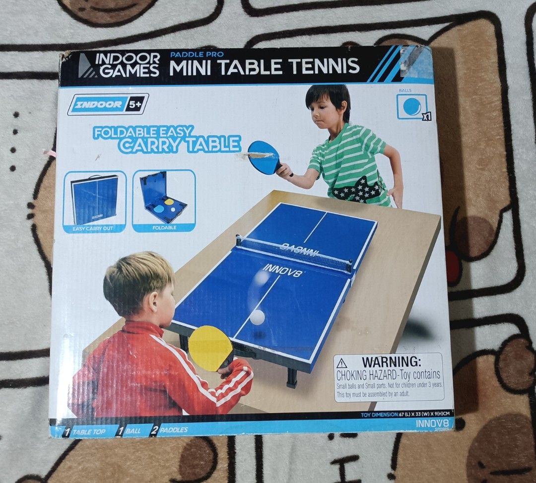 Indoor Paddle Pro Games Mini Table Tennis set (Category: Racket and Ball Sports) located in Manila. Submitted by bwiixx (Listing ID 1442898854, Image 1). Description: - Indoor Mini Table Tennis set - Brand: INNOV8 - Foldable and easy to carry design - Perfect for indoor play - Includes: 1 Table Top, 1 Ball, 2 Paddles - Suitable for ages 5+ and adults - May signs lang na luma na yung box since nakatambak lang. - Bagong bago pa kitang kita sa pictu