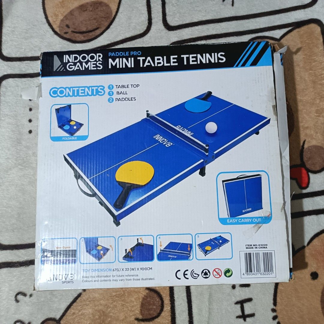 Indoor Paddle Pro Games Mini Table Tennis set (Category: Racket and Ball Sports) located in Manila. Submitted by bwiixx (Listing ID 1442898854, Image 2). Description: - Indoor Mini Table Tennis set - Brand: INNOV8 - Foldable and easy to carry design - Perfect for indoor play - Includes: 1 Table Top, 1 Ball, 2 Paddles - Suitable for ages 5+ and adults - May signs lang na luma na yung box since nakatambak lang. - Bagong bago pa kitang kita sa pictu