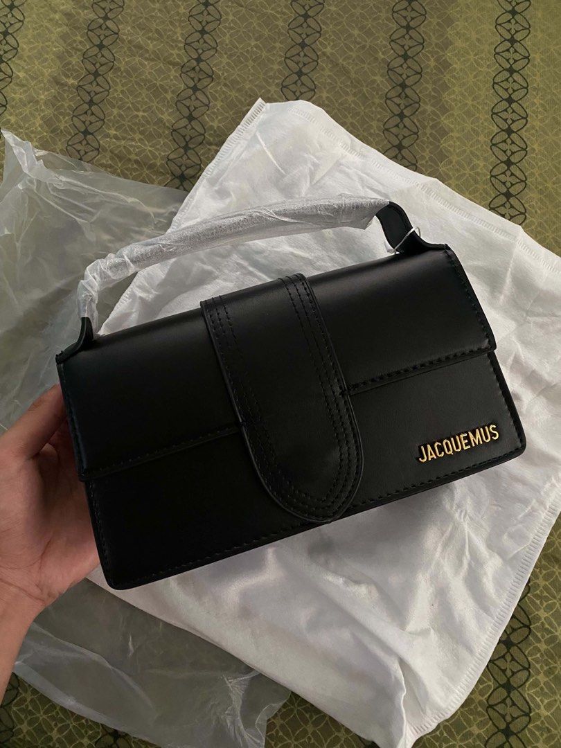 Jacquemus Le Chiquito Bag Black (Category: Luxury Bags & Wallets) located in Manila. Submitted by ixandrei5614161 (Listing ID 1442882938, Image 1). Description: - Black Jacquemus Bag - Leather Material - Versatile: Top handle and adjustable shoulder strap - Secure Magnetic Closure - Elegant Gold Hardware Details - Comes with Original Dust Bag and Packaging - Ideal for evening events or adding a stylish flair to your everyday outfits.
