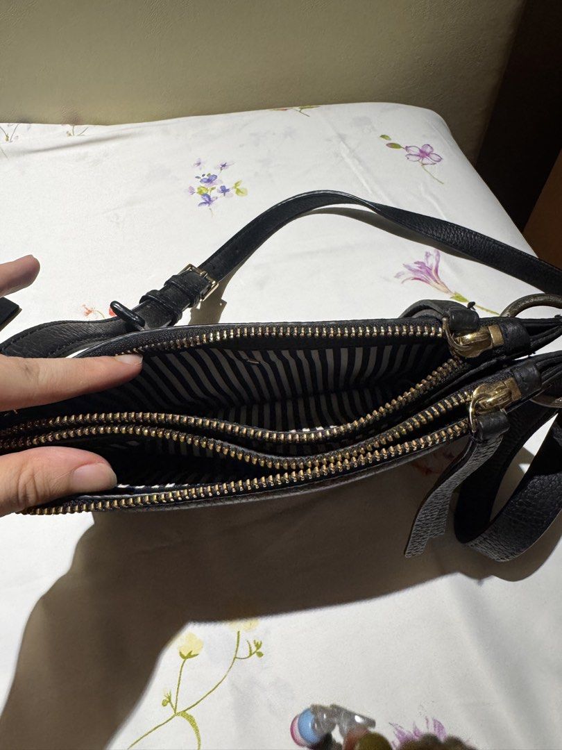 Kate Spade Black Leather Crossbody Bag (Category: Cross-body Bags) located in Quezon City. Submitted by 0913cartz (Listing ID 1442864656, Image 3). Description: - Authentic Kate Spade black leather crossbody bag - Two spacious zippered main compartments and middle compartment (total of 3 compartments) - Elegant gold hardware details - Adjustable strap for comfortable wear - Chic striped interior lining - Ideal for everyday essentials or a night o