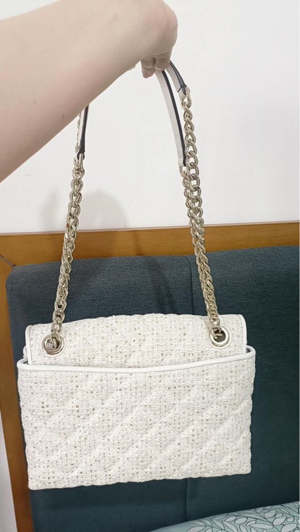 Kate Spade Tweed Shoulder Bag with Chain Strap (Category: Luxury Bags & Wallets) located in Cabanatuan. Submitted by sha_1984 (Listing ID 1442801990, Image 2). Description: - White tweed shoulder bag by Kate Spade - Quilted pattern with subtle sparkle - Secure turn-lock closure - Interior features signature spade pattern lining - Versatile for dressing up or down.