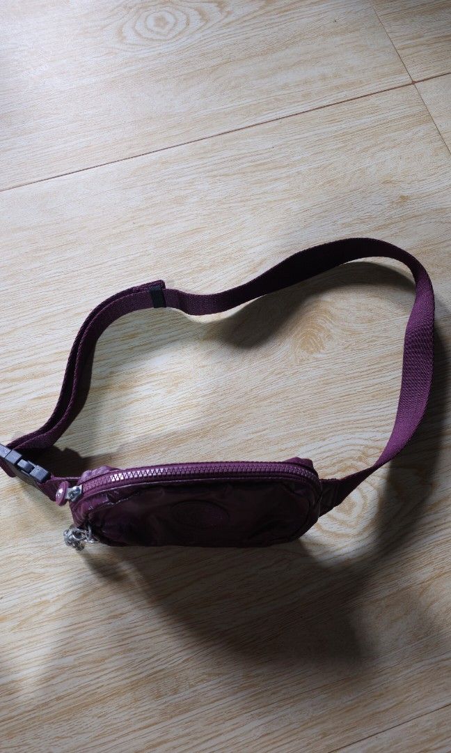 Kipling Alys Waist Pack in Metallic Burgundy (Category: Luxury Bags & Wallets) located in Baguio. Submitted by catdeclutters (Listing ID 1442849374, Image 3). Description: Original Lp + sf 65 J&T Brand new but faded monkey due to storage.