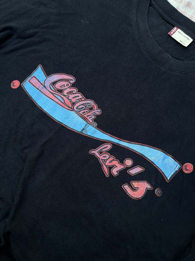 Levi's x Coca Cola Shirt (Category: Tshirts & Polo Shirts ) located in Manila. Submitted by montillano25396 (Listing ID 1442823688, Image 2). Description: Levi's x Coca Cola Dimes: 22 x 28 (XL) Issue: print/ not so visible stain.