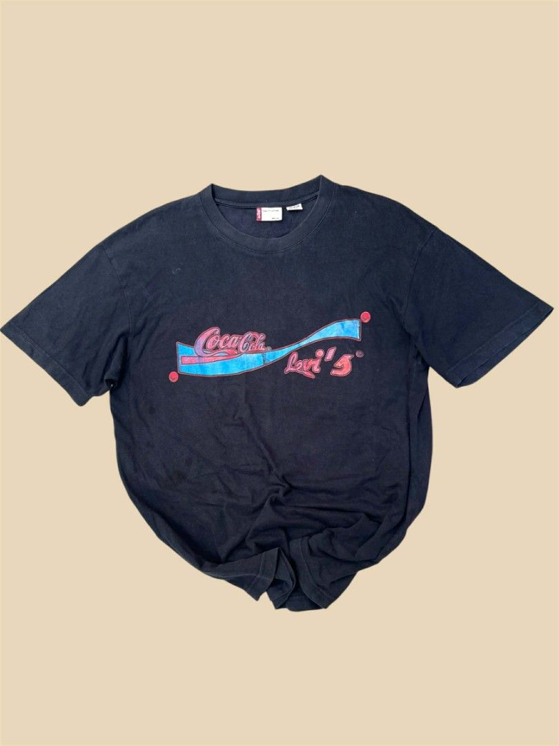 Levi's x Coca Cola Shirt (Category: Tshirts & Polo Shirts ) located in Manila. Submitted by montillano25396 (Listing ID 1442823688, Image 1). Description: Levi's x Coca Cola Dimes: 22 x 28 (XL) Issue: print/ not so visible stain.