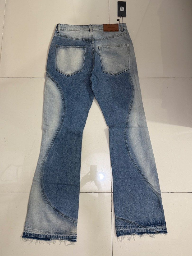 Light Wash Flared Jeans with Panel Design (Category: Jeans) located in Makati City. Submitted by thhird (Listing ID 1442898963, Image 2). Description: - Light wash denim jeans - Unique wavy panel design - Flared leg opening - Raw hem detail.