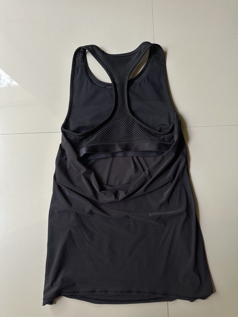Lululemon Black Racerback Tank Top Size 2 (Category: Activewear) located in Rosales. Submitted by dariang22 (Listing ID 1442748078, Image 2). Description: - Lululemon black tank top - Racerback style - Mesh detailing on shoulders and upper back - Built-in bra support - Size: 2 - Ideal for workouts or casual wear.