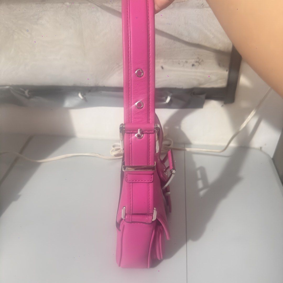 Michael Kors Pink Leather Shoulder Bag (Category: Luxury Bags & Wallets) located in Mabalacat. Submitted by kay_miscak (Listing ID 1442826305, Image 3). Description: - Authentic Michael Kors shoulder bag - Vibrant bright pink leather - Elegant silver buckle detail on front flap - Adjustable strap for comfortable wear - Two convenient front pockets - Ideal for adding a pop of color to any outfit - Perfect for daily use.