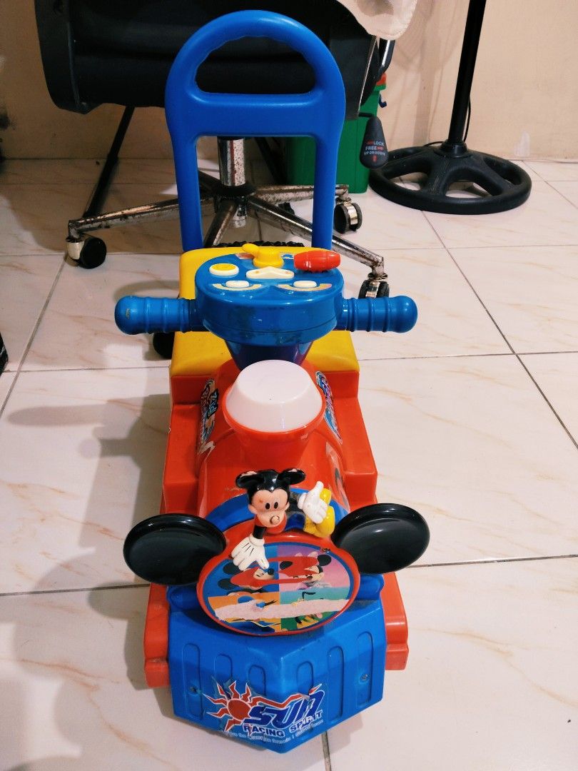 Mickey Mouse Train Ride-on Push Car Toy (Category: Kids Toys) located in Rizal. Submitted by reese511 (Listing ID 1442789113, Image 3). Description: My kids outgrown toy Used good tinadtad lang ng sticker ng mga anak ko😁 Bought from Japan As is where is - Fun Mickey Mouse train ride-on toy - Kids can push or ride on it - Parent push handle included - Bright red, yellow, and blue colors - Features Mickey Mouse graphics - Perfect for toddlers and 