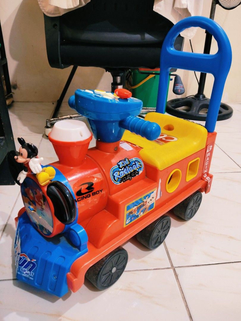 Mickey Mouse Train Ride-on Push Car Toy (Category: Kids Toys) located in Rizal. Submitted by reese511 (Listing ID 1442789113, Image 2). Description: My kids outgrown toy Used good tinadtad lang ng sticker ng mga anak ko😁 Bought from Japan As is where is - Fun Mickey Mouse train ride-on toy - Kids can push or ride on it - Parent push handle included - Bright red, yellow, and blue colors - Features Mickey Mouse graphics - Perfect for toddlers and 