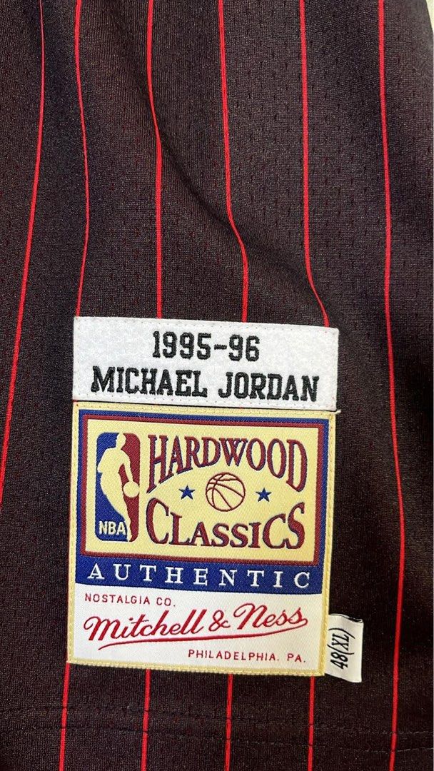 Mitchell & Ness Michael Jordan 1995-96 Bulls Jersey (Category: Activewear) located in San Pedro. Submitted by ajcee (Listing ID 1442744746, Image 3). Description: - Authentic Mitchell & Ness Hardwood Classics Jersey - Features Michael Jordan's 1995-96 Chicago Bulls #23 - Classic black with red pinstripe design - Perfect collectible for any Michael Jordan enthusiast Original Price when bought: ₱19,999.00 From: NBA Store Philippines Rfs: Wedding Fu
