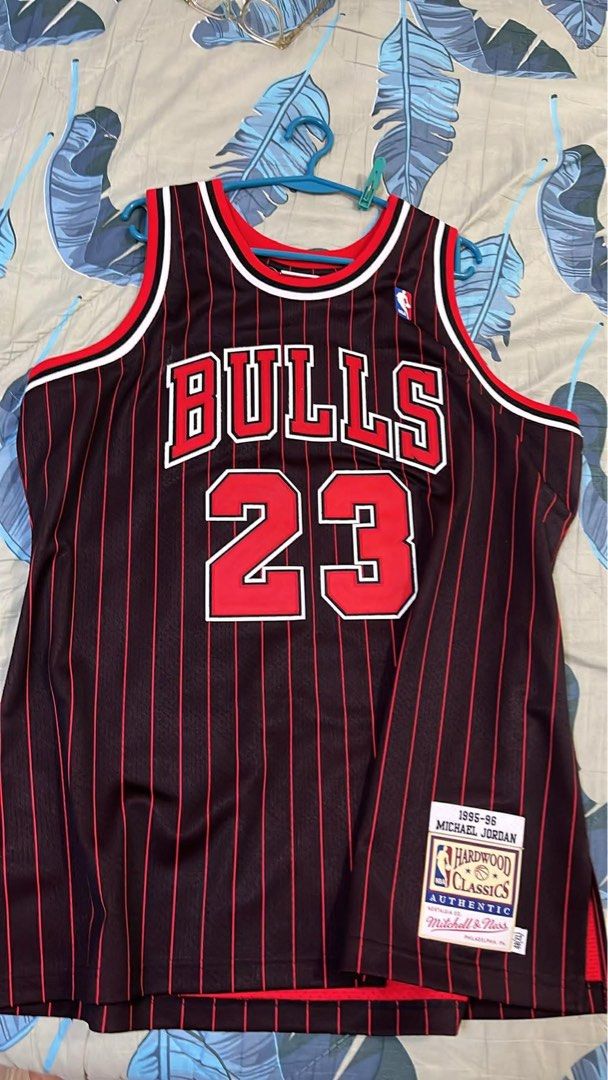 Mitchell & Ness Michael Jordan 1995-96 Bulls Jersey (Category: Activewear) located in San Pedro. Submitted by ajcee (Listing ID 1442744746, Image 1). Description: - Authentic Mitchell & Ness Hardwood Classics Jersey - Features Michael Jordan's 1995-96 Chicago Bulls #23 - Classic black with red pinstripe design - Perfect collectible for any Michael Jordan enthusiast Original Price when bought: ₱19,999.00 From: NBA Store Philippines Rfs: Wedding Fu