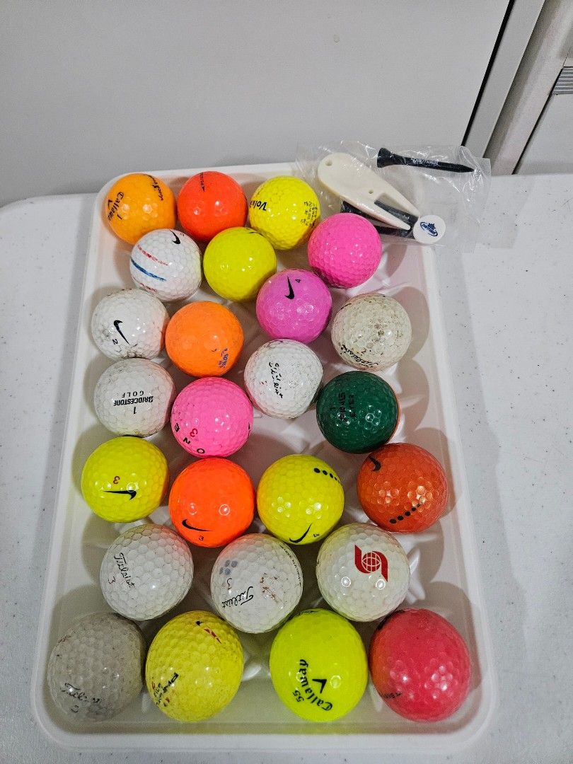 Mixed Golf Balls & Pouch (Category: Golf) located in Caloocan City. Submitted by rm.diaz (Listing ID 1442743325, Image 1). Description: - Bundle of assorted golf balls (various brands like Titleist, Nike, Callaway, and more) - Includes a navy pouch with 'MICHAELA' printed on it - Comes with a golf tee holder, tees, and a divot tool - Ideal for practice sessions or casual rounds of golf.