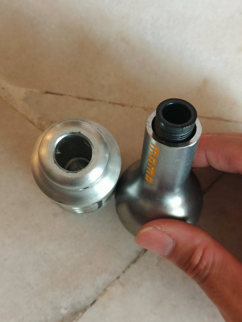 Momo & EPC Silver Gear Knobs (Category: Auto Accessories) located in Subang Jaya. Submitted by therealyos (Listing ID 1442845665, Image 2). Description: - Selling a pair of metal gear knobs: 1 Momo, 1 EPC. - Both are made of solid heavy metal. - Momo knob features engraved gear pattern (1, 2, 3, 4, ,5, R) on top. - EPC knob boasts a distinct, stylish design. - Designed to fit most manual transmission vehicles. - Ori price rm60 per piece..