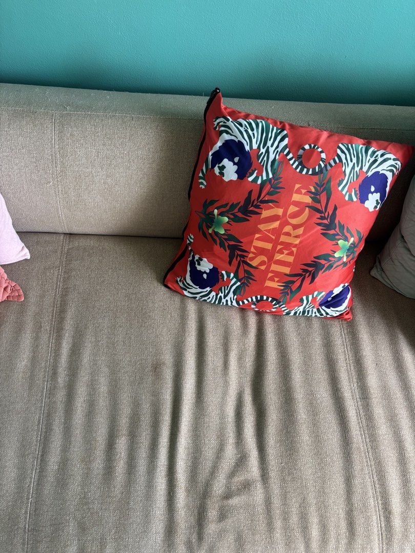 Muji sofabed with wooden frame (Category: Sofas) located in Pasig City. Submitted by ninabiscuit (Listing ID 1442756572, Image 2). Description: Still fully functional but well worn sofabed. The back reclines fully to become a bed. Muji is the brand. All damages documented on the photos. It's really well loved, our cats used to scratch it haha. Selling to get a bigger couch. Just needs to be deep cleaned and upholstered if you care about the threa