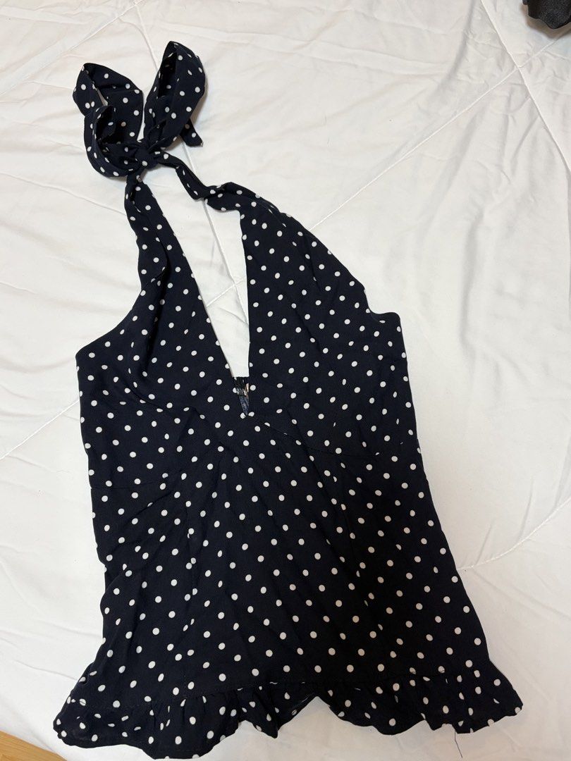 Navy Polka Dot Halter Neck Top with Ruffle Hem (Category: Sleeveless) located in Quezon City. Submitted by morespace555 (Listing ID 1442837970, Image 2). Description: Bought this for ₱450 if i'm not mistaken.