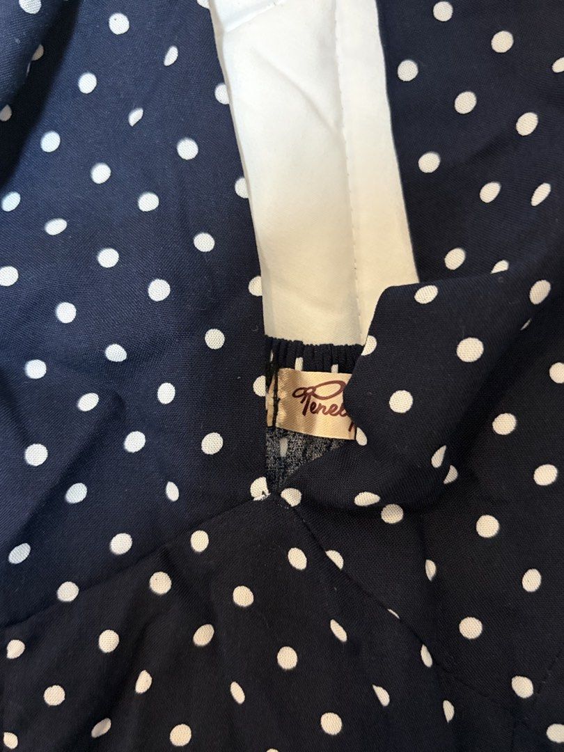 Navy Polka Dot Halter Neck Top with Ruffle Hem (Category: Sleeveless) located in Quezon City. Submitted by morespace555 (Listing ID 1442837970, Image 3). Description: Bought this for ₱450 if i'm not mistaken.