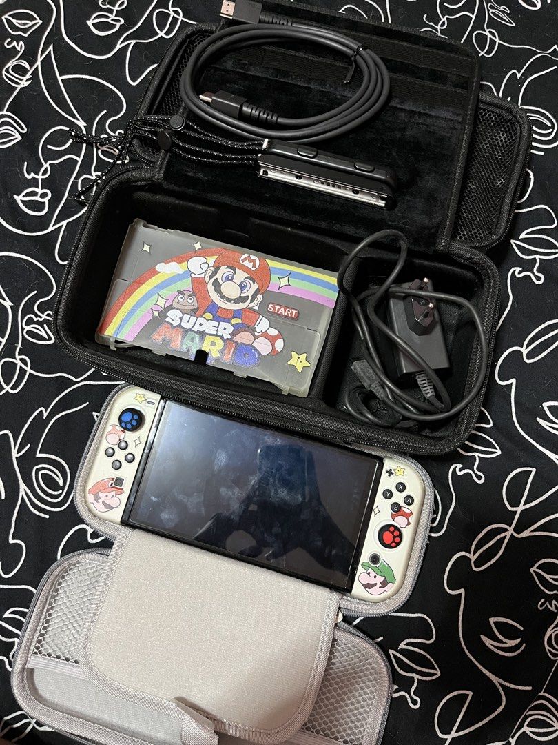 Nintendo Switch Oled (Category: Nintendo) located in Lubao. Submitted by jivss (Listing ID 1442866941, Image 1). Description: Nintendo switch oled No issue Inclusions: charger adaptor super mario case lanyards 2 boxes .