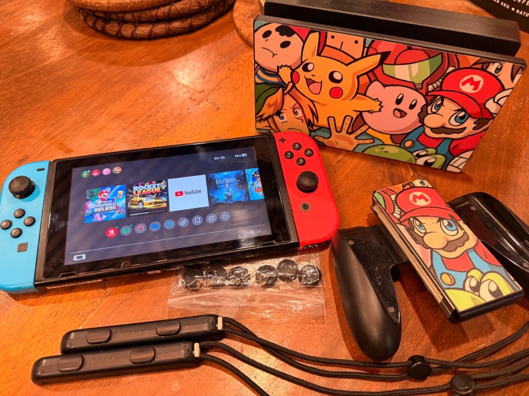 Nintendo Switch Console with Custom Dock and Accessories (Category: Nintendo) located in Caloocan City. Submitted by egiegameshop (Listing ID 1442775701, Image 2). Description: pwede via credit card @8,000 location : Calumpang Marikina city - Nintendo Switch Console - Neon Red & Blue Joy-Cons - Original Dock (naka skin lang) - Original Charger - Joy-Con Grip - Extra Thumb Grips - Perfect for both home and on-the-go gaming - All items pictured are