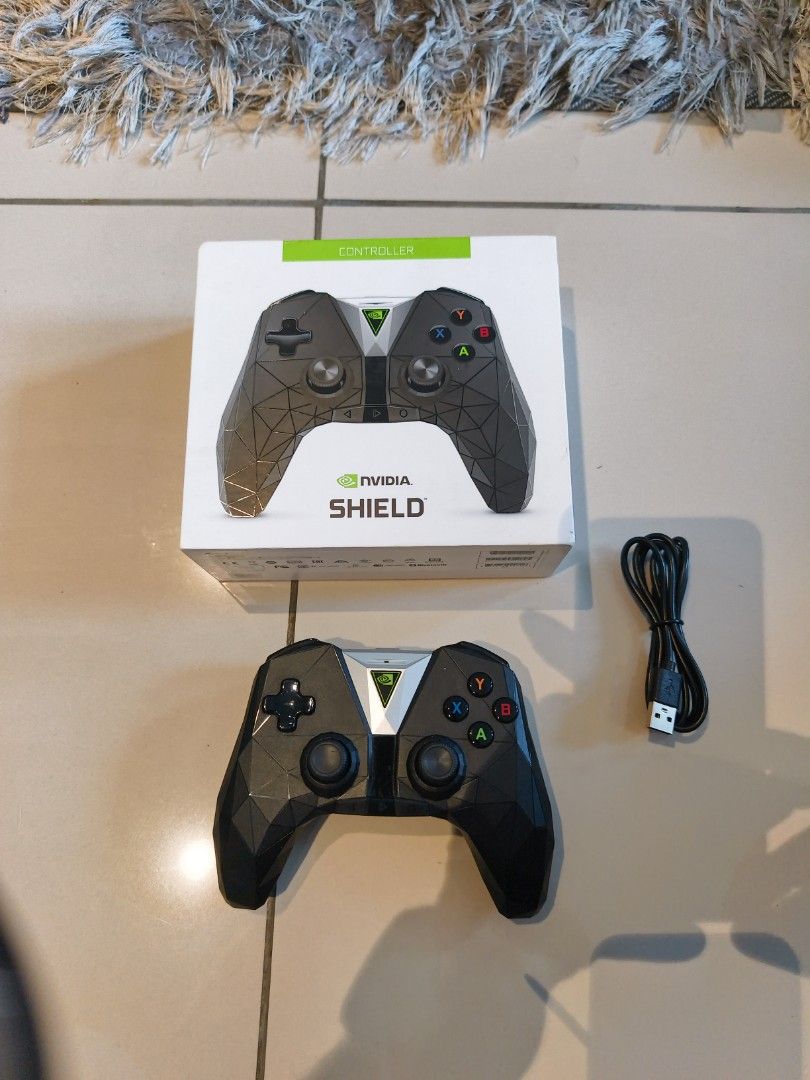 NVIDIA SHIELD Controller with USB Cable (Category: Controllers) located in Kuala Lumpur. Submitted by grandwolf_0287a2 (Listing ID 1442800665, Image 1). Description: - Genuine NVIDIA Shield Controller - Includes original box - Comes with USB charging cable - Ideal for NVIDIA Shield gaming - Fully tested and in working condition.