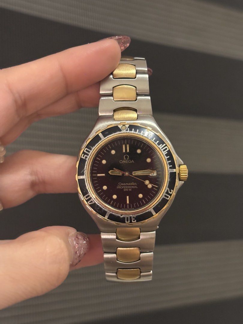 Omega Seamaster Professional Two-Tone Dive Watch (Category: Luxury Watches) located in Subic. Submitted by loveforluxe. (Listing ID 1442864835, Image 1). Description: - Omega Seamaster Professional - 18k Two-tone stainless steel and gold bracelet - Black bezel with gold markings - Dark dial with gold hands and markers - Water resistant 200m - Classic dive watch, suitable for everyday or special occasions - Runs well.
