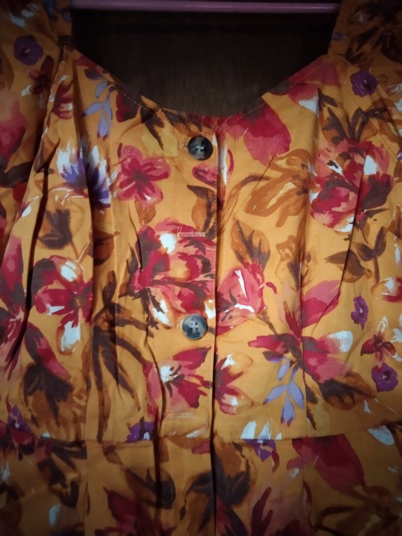Orange Floral Puff Sleeve Romper with Pockets (Category: Rompers) located in Manila. Submitted by fiercefish.b07a25 (Listing ID 1442777879, Image 2). Description: - Adorable orange romper with a vibrant floral print. - Features stylish puff sleeves and a flattering square neckline - Convenient two-button and zipper front closure. - Includes practical front pockets for essentials. - Ideal for casual wear, beach days, or summer parties. - Easy to w