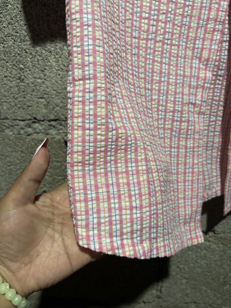 Pink Plaid Short Sleeve Button-Up Shirt (Category: Shirts) located in Baguio. Submitted by dein_allure (Listing ID 1442877468, Image 3). Description: 🫒Cute pink plaid design 🫒Short sleeves and collared neckline 🫒Button-up front 🫒Textured seersucker-like fabric 🫒Versatile for casual wear or layering 🫒Easy to style with jeans or short 🫒mop:gcash 🫒mod:jnt 🫒baguio loc(drop off or pick up if same place) .