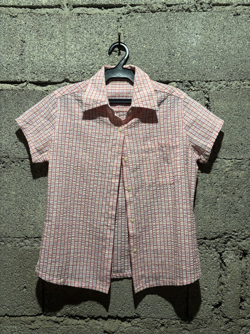 Pink Plaid Short Sleeve Button-Up Shirt (Category: Shirts) located in Baguio. Submitted by dein_allure (Listing ID 1442877468, Image 1). Description: 🫒Cute pink plaid design 🫒Short sleeves and collared neckline 🫒Button-up front 🫒Textured seersucker-like fabric 🫒Versatile for casual wear or layering 🫒Easy to style with jeans or short 🫒mop:gcash 🫒mod:jnt 🫒baguio loc(drop off or pick up if same place) .