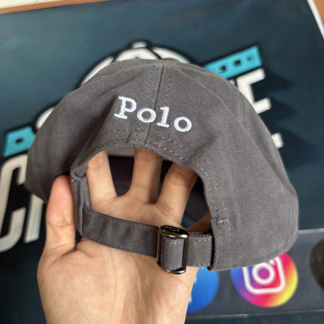 Polo Ralph Lauren Cap Grey Pony Logo (Category: Caps & Hats) located in Balagtas. Submitted by capspree (Listing ID 1442802934, Image 2). Description: - Authentic Polo Ralph Lauren cap - Features classic embroidered pony logo on the front - 'Polo' embroidered on the back - Adjustable strap for a customized fit - Brand new with tags attached - Perfect for casual, everyday wear.