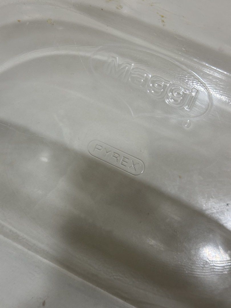 Pyrex Maggi Glass Baking Dish (Category: Bakeware) located in Manila. Submitted by tenshiii185 (Listing ID 1442796843, Image 2). Description: Vintage Pyrex Maggi oval baking dish with handles. Perfect for baking and serving. Shows minor signs of use, still fully functional. A kitchen classic..