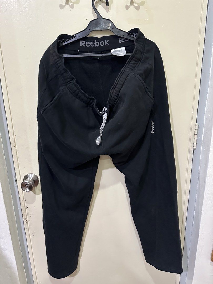 Reebok Black Sweatpants Joggers Size L (Category: Joggers) located in Manila. Submitted by roseluxuryitems (Listing ID 1442901238, Image 3). Description: - Reebok Black Sweatpants Joggers Size Large - Elastic waistband with adjustable drawstring - Reebok logo detail on waistband and leg - Soft fleece lining for added warmth - Ideal for casual wear, lounging, or workouts.
