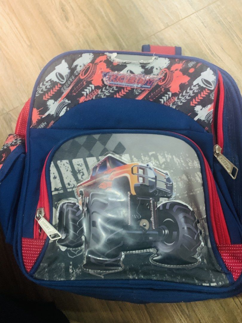 Robby Rabbit Monster Truck Backpack for Kids (Category: Backpacks) located in Rodriguez. Submitted by lovekotommm (Listing ID 1442833370, Image 1). Description: - Cool blue backpack with an awesome monster truck design. - Robby Rabbit brand. - Spacious main compartment for books and essentials. - Convenient smaller front pocket. - Adjustable, padded straps for maximum comfort. - Ideal for school, day trips, or everyday use..