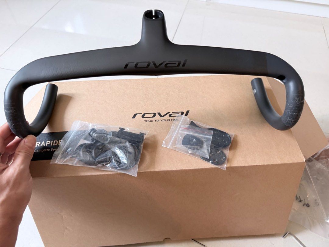 Roval Rapide Integrated Carbon Handlebar 420mm (Category: Parts & Accessories) located in Singapore. Submitted by ass_works (Listing ID 1442745844, Image 3). Description: - Roval Rapide integrated carbon handlebar - Stem: 90mm length, -6 degree angle - Bar Width: 420mm - Drop: 127mm - Reach: 75mm - Includes computer mount accessories - Original box included.