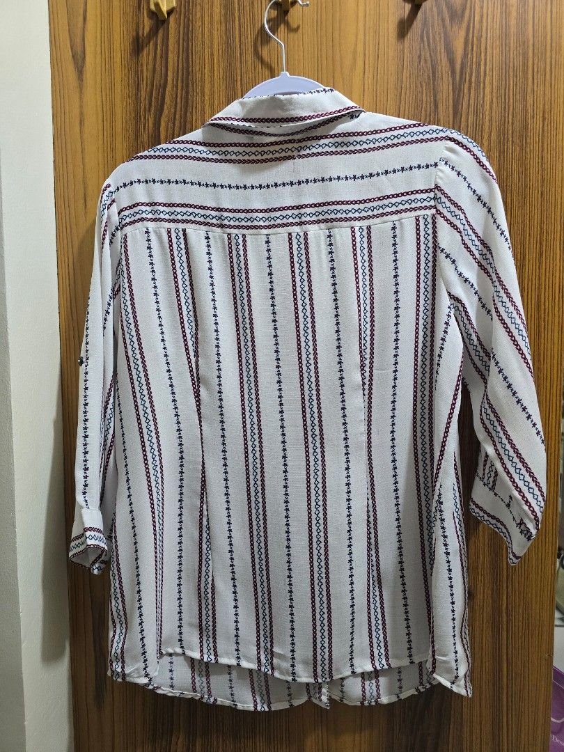 Samlin White Striped Button-Up blouse (Category: Shirts) located in Valenzuela. Submitted by SecondChances (Listing ID 1442814060, Image 3). Description: - Crisp white shirt with thin red and blue stripes - Classic button-up front with a neat collar - Long sleeves with adjustable button cuffs - Versatile for both casual outings and office wear - Ideal for everyday comfort and style measurements (in inches): shoulder - 15.5 armhole - 19 sleeves - 