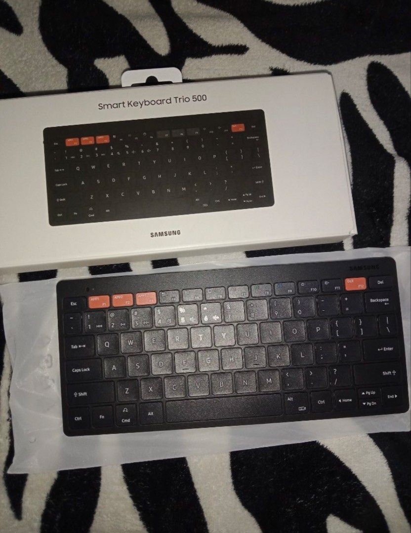 Samsung Smart Keyboard Trio 500 (Category: Computer Keyboard) located in Taguig. Submitted by _itsmargauxfinds (Listing ID 1442919783, Image 2). Description: - Samsung Smart Keyboard Trio 500 - Wireless connectivity - Dedicated keys for Samsung DeX - Compact and portable design - Ideal for multitasking on your phone or tablet - Original box included - Price is still negotiable (pm is the key).
