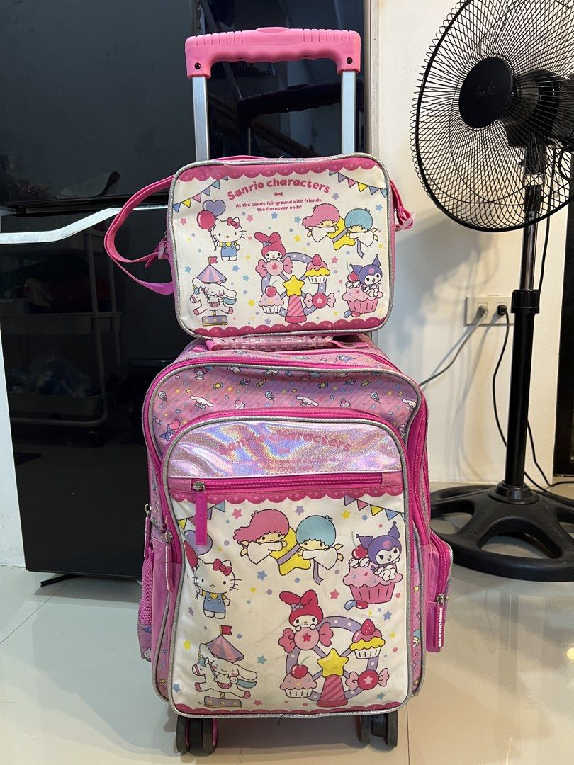 Sanrio Characters School Trolley & Lunch Bag Set (Category: Strollers) located in Marikina City. Submitted by aikavml (Listing ID 1442844668, Image 1). Description: - Sanrio Characters trolley & matching insulated lunch bag - Features Hello Kitty, My Melody, Little Twin Stars, Cinnamoroll and Kuromi - Bag has 360 wheels and a retractable handle for easy transport - Insulated Lunch bag conveniently attaches to the front of the main bag - Spacious 