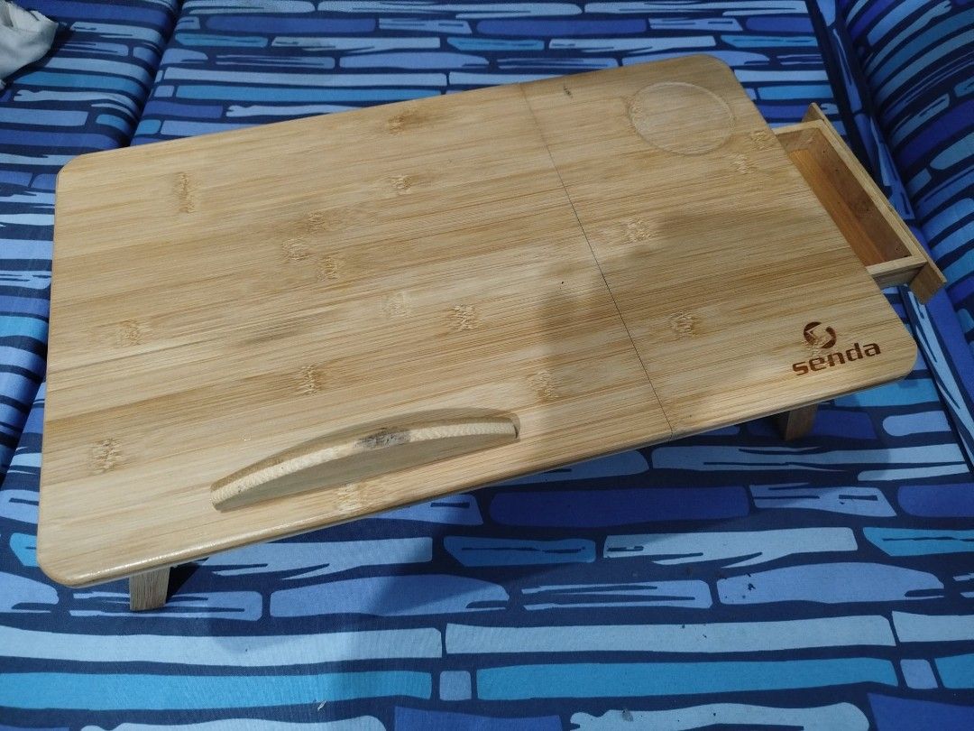 Senda Portable Laptop Desk / Study Table (Category: Office Furniture & Fixtures) located in Quezon City. Submitted by anyavittoria01651 (Listing ID 1442793861, Image 3). Description: This is adjustable and features a small storage drawer and built-in cup holder..