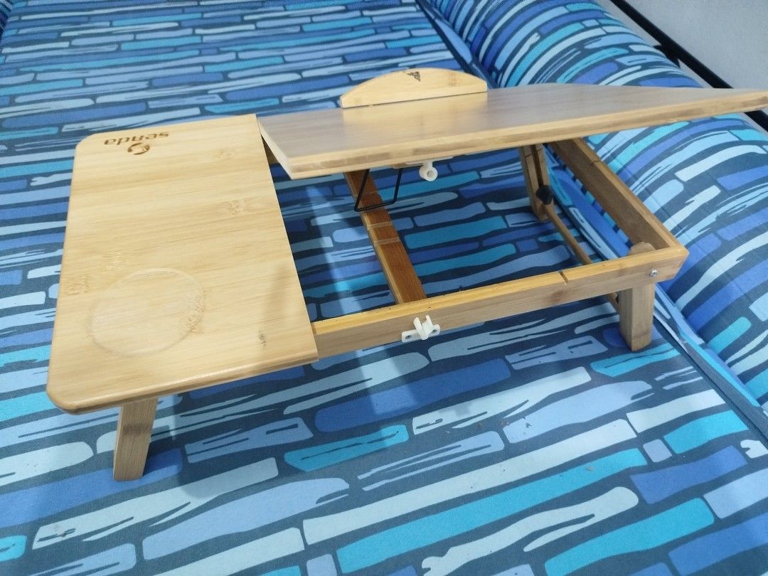 Senda Portable Laptop Desk / Study Table (Category: Office Furniture & Fixtures) located in Quezon City. Submitted by anyavittoria01651 (Listing ID 1442793861, Image 2). Description: This is adjustable and features a small storage drawer and built-in cup holder..