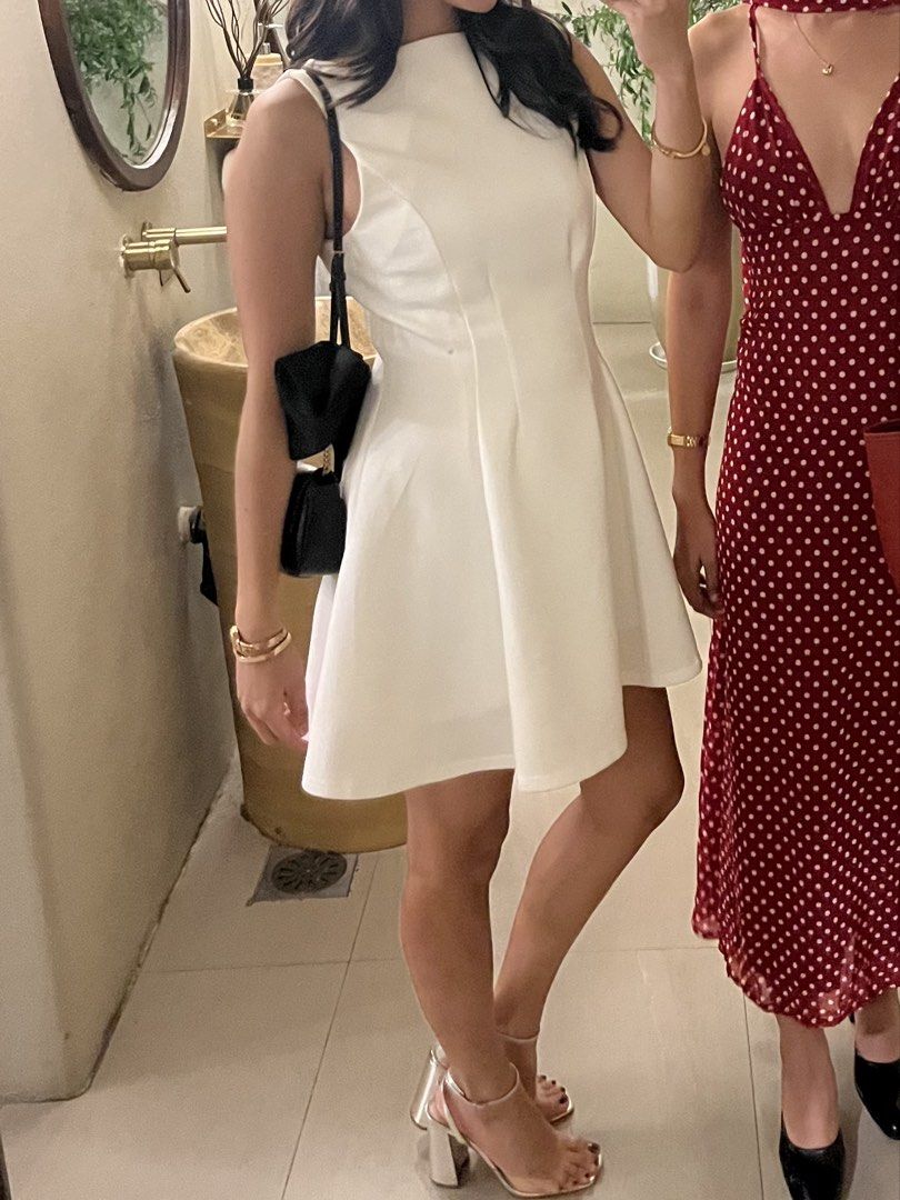 Sleeveless White A-Line Mini Dress (Category: Dresses) located in Dasmarinas. Submitted by 365daysofsummer (Listing ID 1442910743, Image 1). Description: - Sleeveless white dress - High neckline - A-line silhouette, flares from the waist - Above-the-knee length - Ideal for parties and events - Comfortable fit - Versatile for accessorizing - worn only twice.
