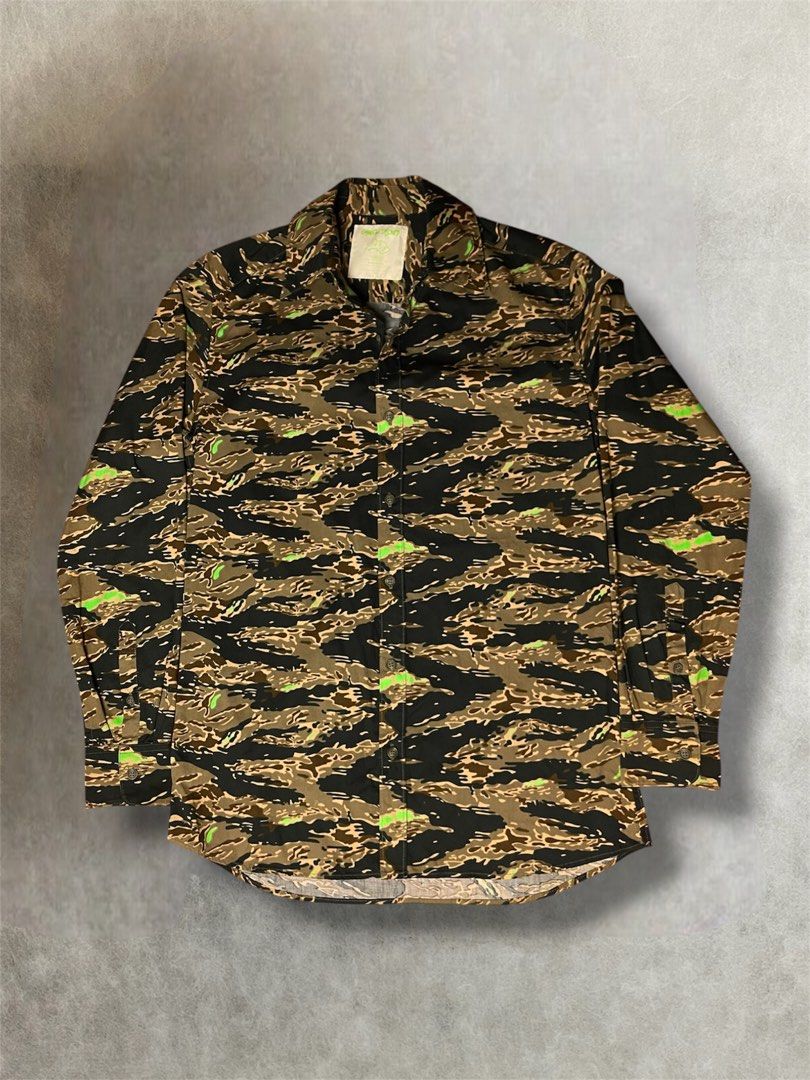 SS2001 Undercover dessert neon camo button down shirt (Category: Activewear) located in Manila. Submitted by killzarchival (Listing ID 1442735235, Image 1). Description: SS2001 Undercover dessert neon camo button down shirt *Condi:7/10 *Good condition with normal sign of using size:Medium fits large slim Pit to pit:20.5 Length:30 Shoulder:17.5 Sleeve:25 Hem:20 .