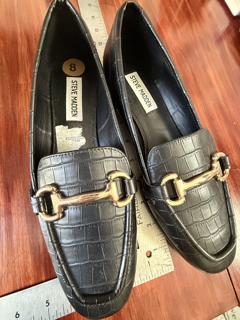 Steve Madden Black Croc Embossed Loafers Size 8 (Category: Loafers) located in Paranaque City. Submitted by shop333 (Listing ID 1442924537, Image 2). Description: - LISTED PRICE IS THE LAST PRICE BRAND NEW FROM THE U.S. - please scroll photos for exact size Brand: Steve Madden - Color: Black - Style: Loafers - Texture: Croc embossed - Detail: Gold buckle on front - Size: 8 - Versatility: Perfect for dressing up or down.