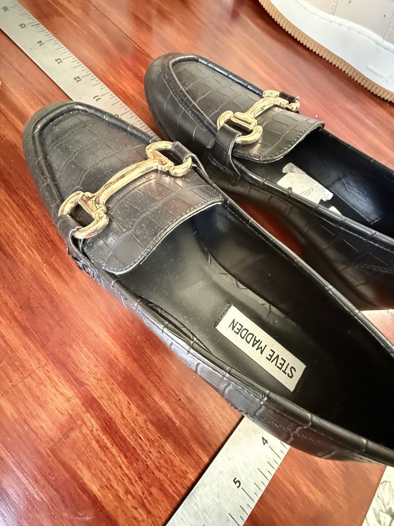 Steve Madden Black Croc Embossed Loafers Size 8 (Category: Loafers) located in Paranaque City. Submitted by shop333 (Listing ID 1442924537, Image 3). Description: - LISTED PRICE IS THE LAST PRICE BRAND NEW FROM THE U.S. - please scroll photos for exact size Brand: Steve Madden - Color: Black - Style: Loafers - Texture: Croc embossed - Detail: Gold buckle on front - Size: 8 - Versatility: Perfect for dressing up or down.