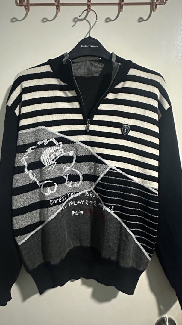 Striped Quarter Zip Sweater with Graphic Design (Category: Coats, Jackets and Outerwear) located in Manila. Submitted by omenagi (Listing ID 1442893851, Image 1). Description: - Trendy black and white striped sweater - Features a cool graphic design on the front - Convenient quarter zip neckline - Solid black sleeves for a stylish contrast - Ideal for everyday casual wear - Unique and eye-catching design.