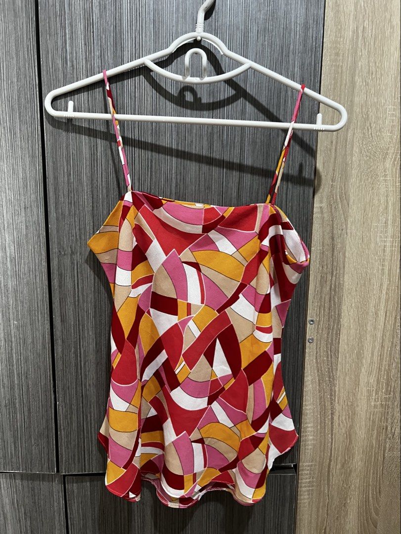 summer print sleeves neck top (Category: Sleeveless) located in Quezon City. Submitted by cheeksieee (Listing ID 1442923131, Image 1). Description: summer top! bought it from another seller, says its a customized design - fits to small-medium - little to no signs of usage - used 3-4 times - rfs: decluttering + not my style anymore 🚚 thru lalamove 🧾 thru gcash.