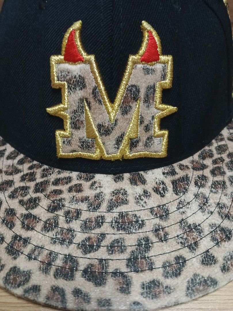 Super Massive Bound SMB Black Cap with Leopard Print Brim (Category: Hats & Beanies) located in Davao. Submitted by jmhocson (Listing ID 1442841419, Image 3). Description: K-pop Jessica Jung - Black cap with a stylish leopard print brim. - Features a prominent 'M' logo adorned with devil horns and wings. - Side patch reads 'Super Massive Bound Registered Trademark'. - 'SMB' logo detail on the back. - Adjustable snapback for a comfortable fit. - I